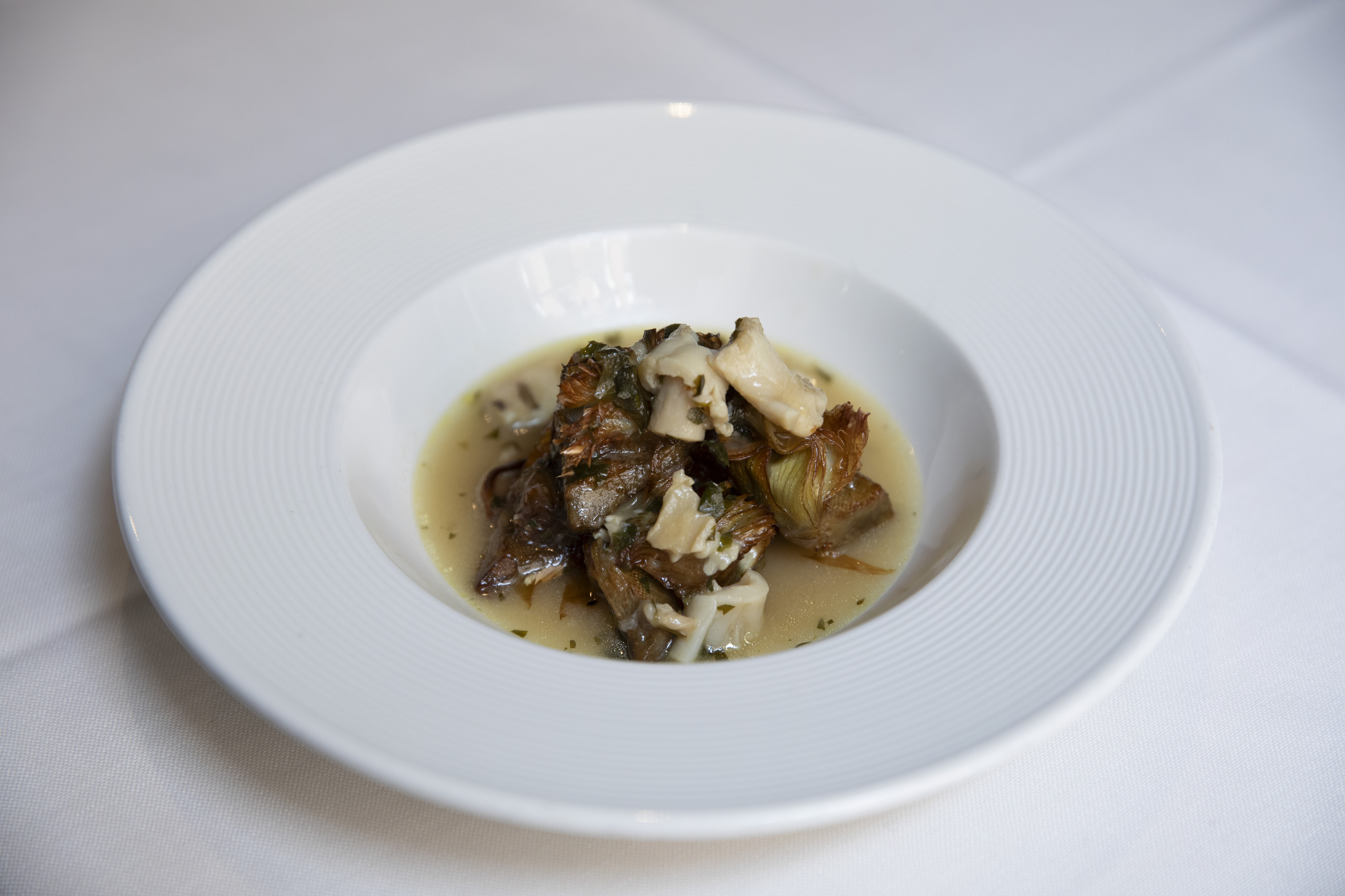 Alcachofas con callos de bacalao.
