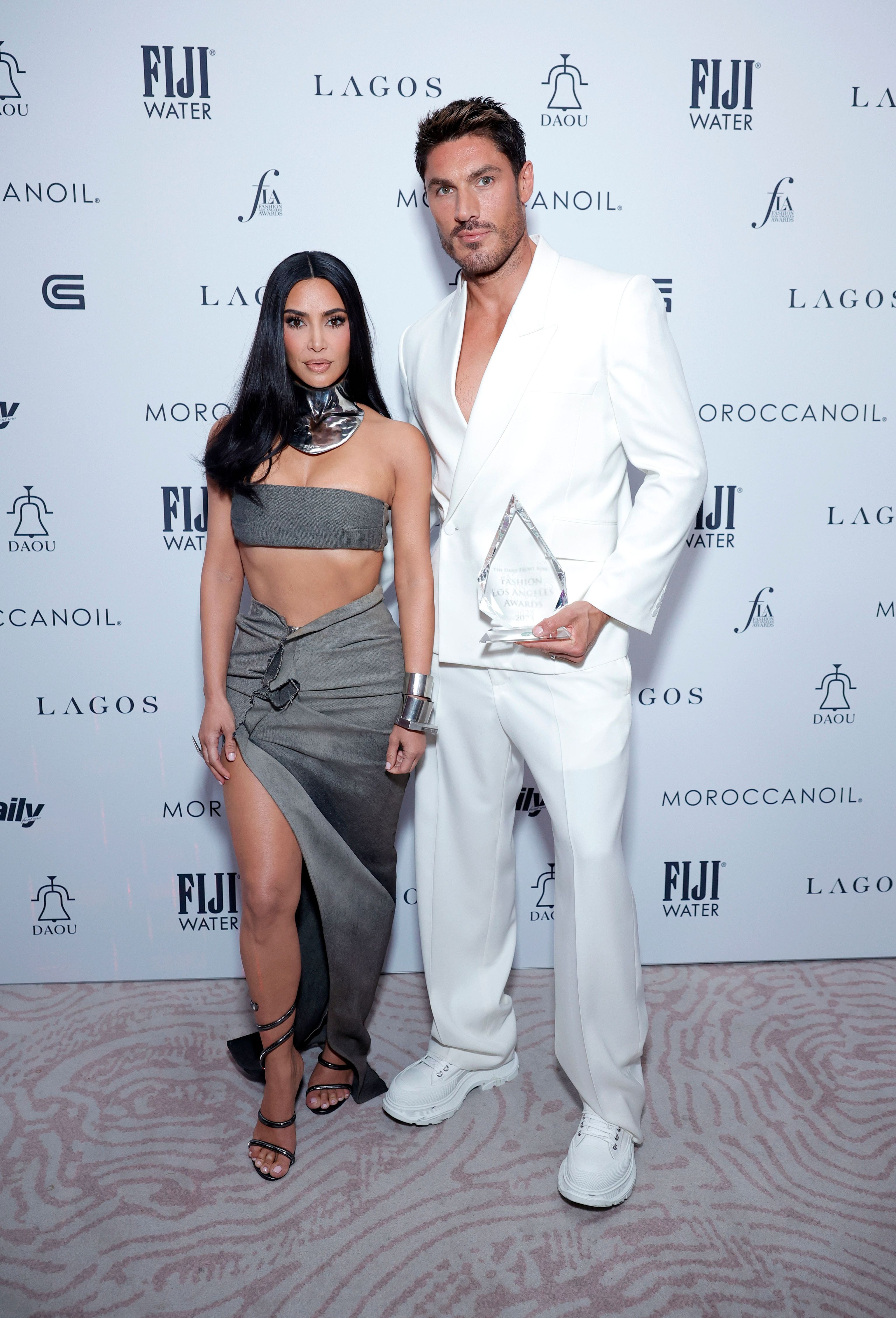 Con Kim Kardashian en un photocall.
